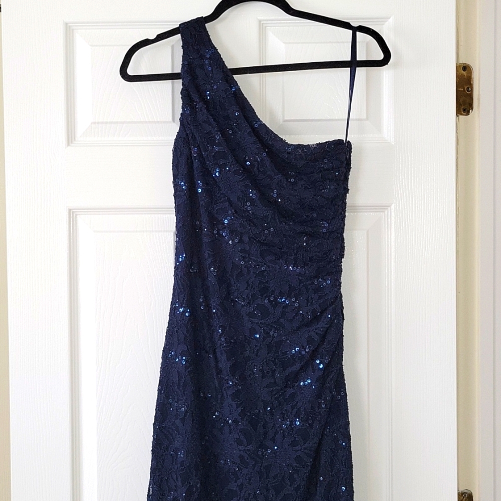 One shoulder navy blue evening gown.